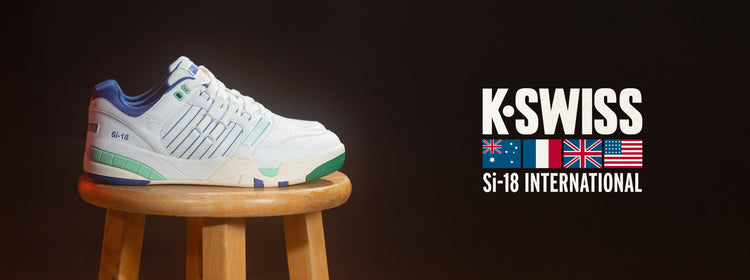 Stylish K-Swiss Si-18 sneaker with blue, green, and white accents on stool with flags and branding