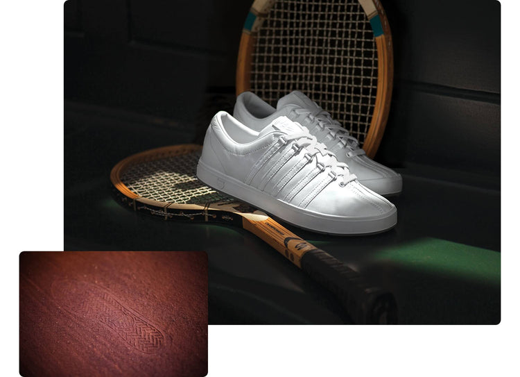 Two images: Larger image of K-Swiss classic white sneakers on two tennis rackets and a green bench; smaller image of a K-Swiss shoeprint on a clay floor