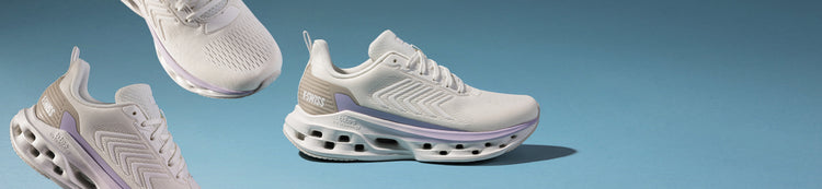 White and gray K-Swiss Melrose Tubes Lite shoes on a blue background