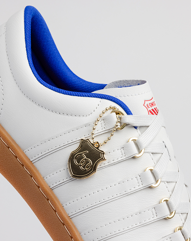 Close up of CLASSIC 66 NXT 60TH white sneaker with gold charm
