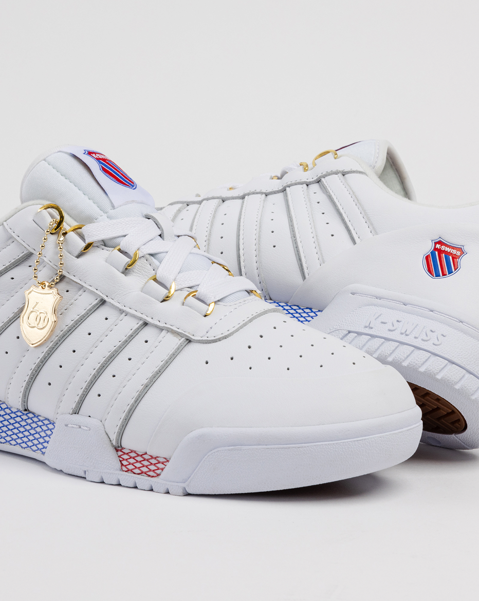 GSTAAD 60TH white leather sneakers angled side view with logo detail
