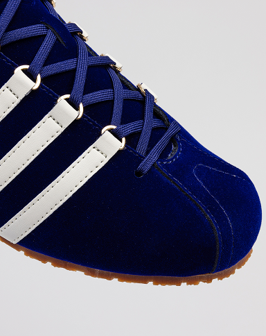 Close-up of BEFORE THE CLASSIC 60TH navy suede sneaker upper design