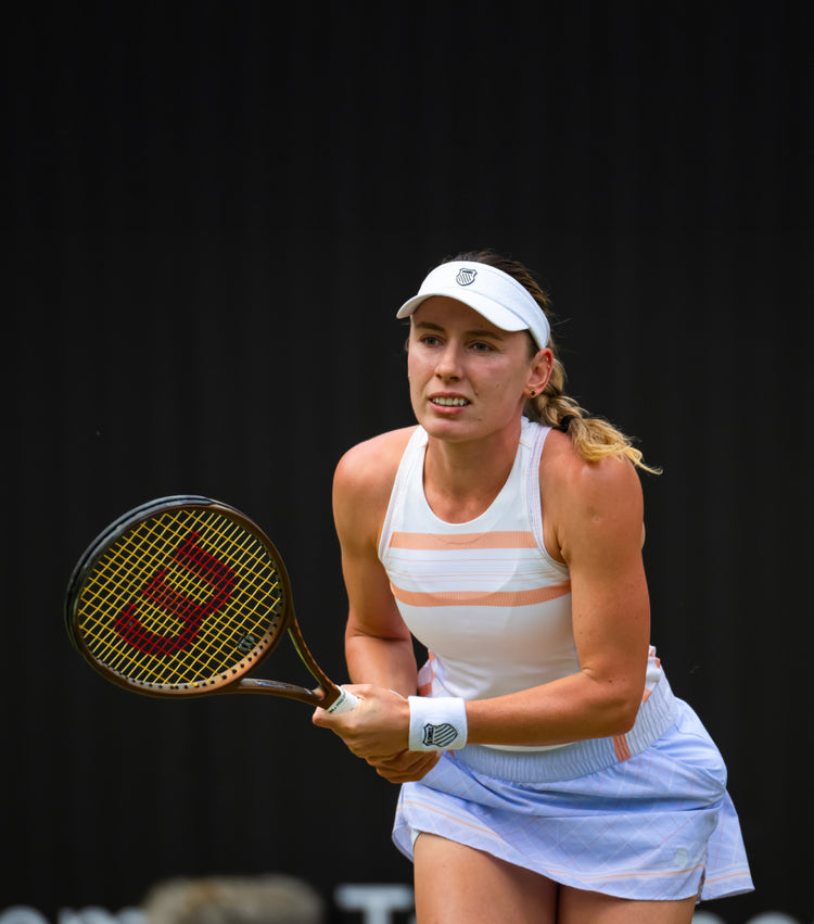 Ekaterina Alexandrova playing tennis in K-Swiss clothing