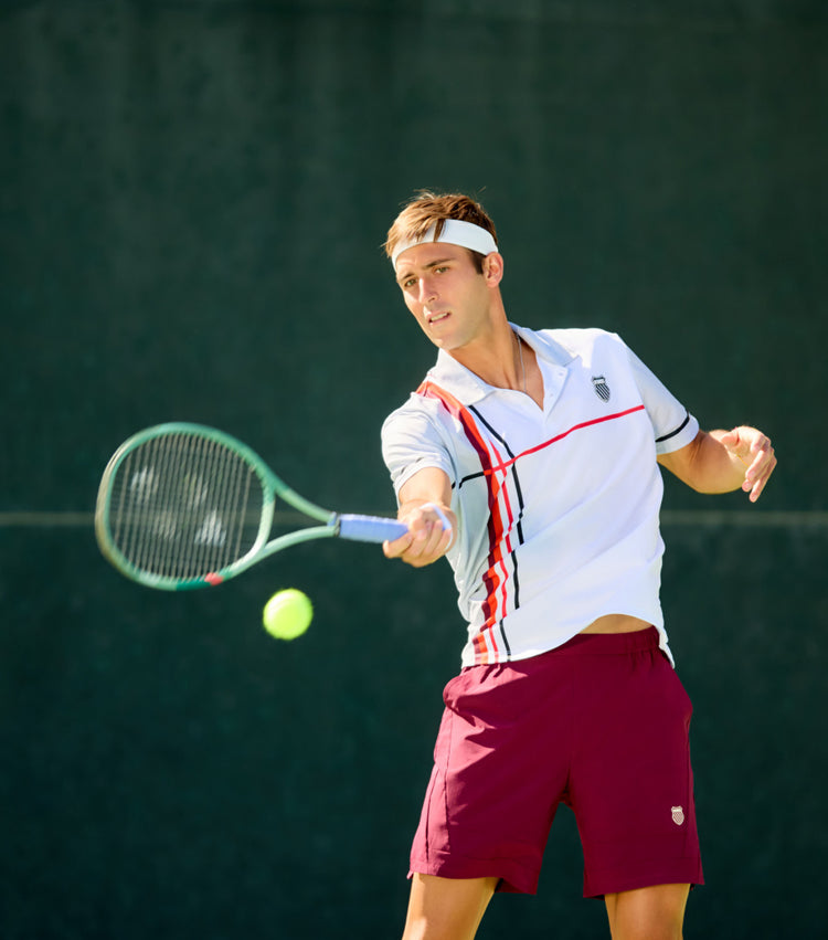 Tomas Etcheverry playing tennis in K-Swiss clothing