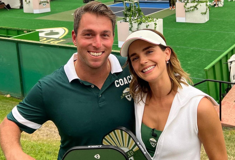 Matt Manasse posing next to a young woman at a pickleball event