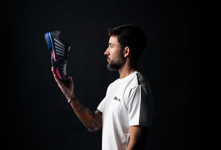 Sanyo Gutierrez holding a K-Swiss padel shoe