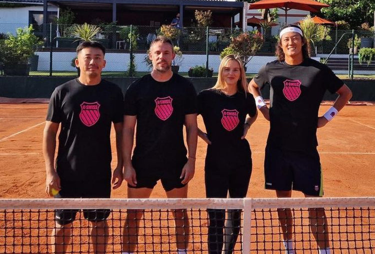 Zhizhen Zhang smiling alongside three other tennis players all wearing K-Swiss t-shirts