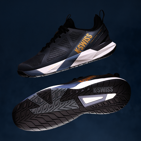 A pair of K-Swiss athletic sneakers shown against a dark navy background, with one shoe displaying the side profile and the other showing the textured outsole.