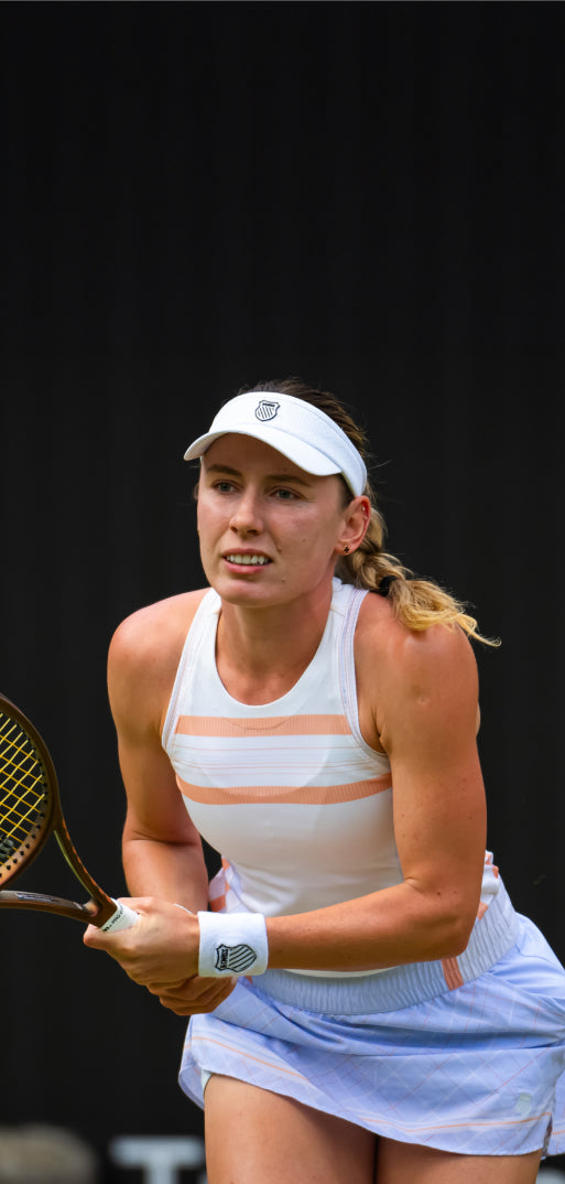 Ekaterina Alexandrova playing tennis in K-Swiss clothing