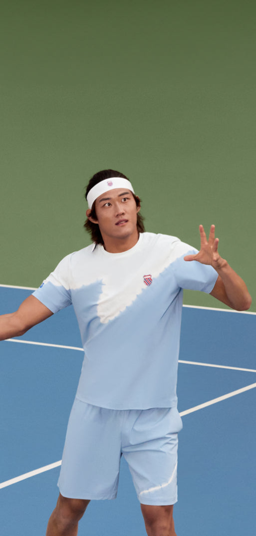 Zhizhen Zhang playing tennis in K-Swiss clothing