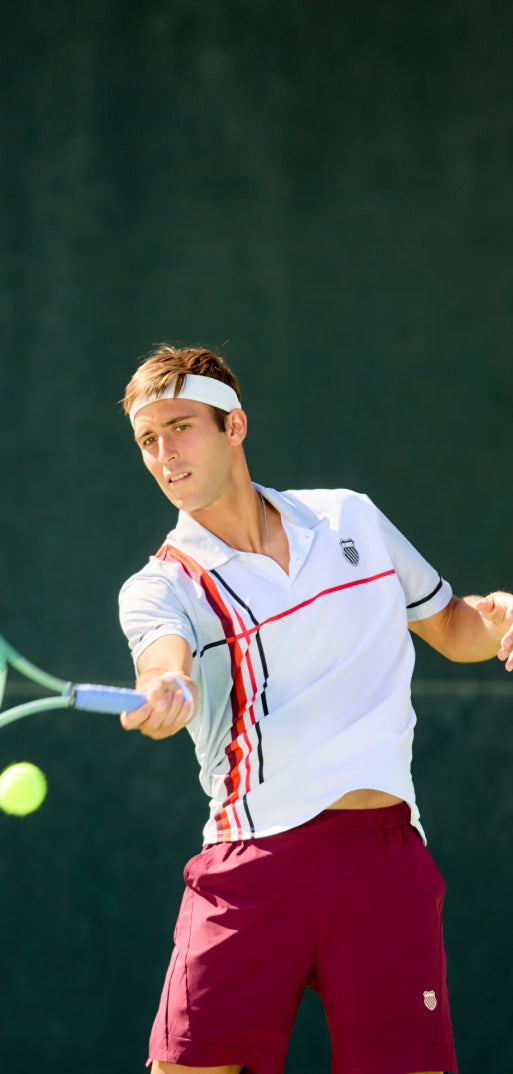 Tomas Etcheverry playing tennis in K-Swiss clothing