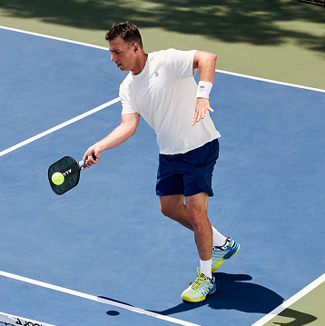 Matt Manasse playing pickleball on a court
