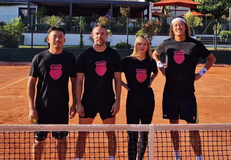 Zhizhen Zhang smiling alongside three other tennis players all wearing K-Swiss t-shirts