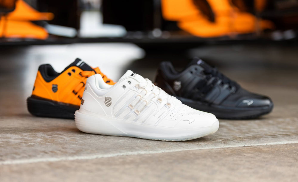 Image of three K-Swiss x McLaren shoe styles on a garage floor