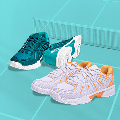 Two pairs of sports shoes, one teal and white, one white and orange, on a blue grid background.